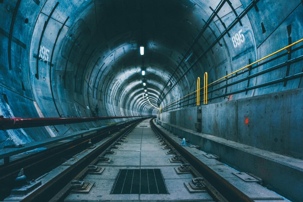 pexels photo 3536263 3536263 A perspective view of an underground subway tunnel with visible railway tracks.