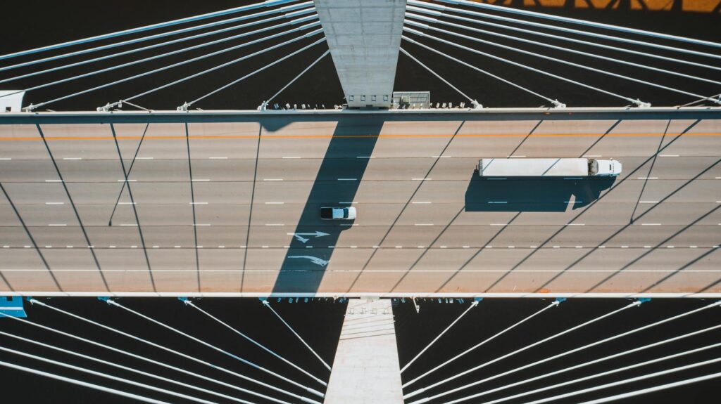 pexels photo 4372155 4372155 Aerial shot of a modern suspension bridge in Louisville with vehicles in motion.